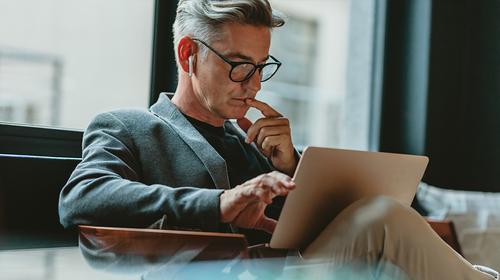 Investor interacting with a laptop